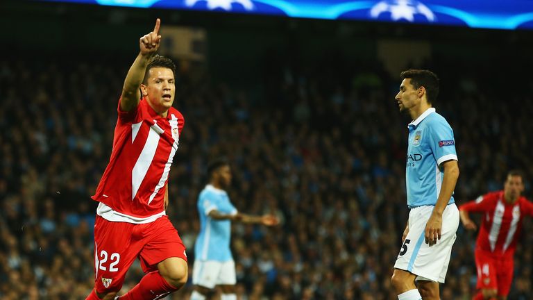 Yevhen Konoplyanka of Sevilla celebrates scoring the opening goal against Manchester City