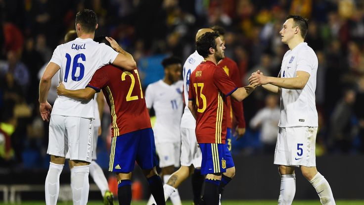 Man Utd team-mates Juan Mata and Phil Jones shake hands after Spain's win over England
