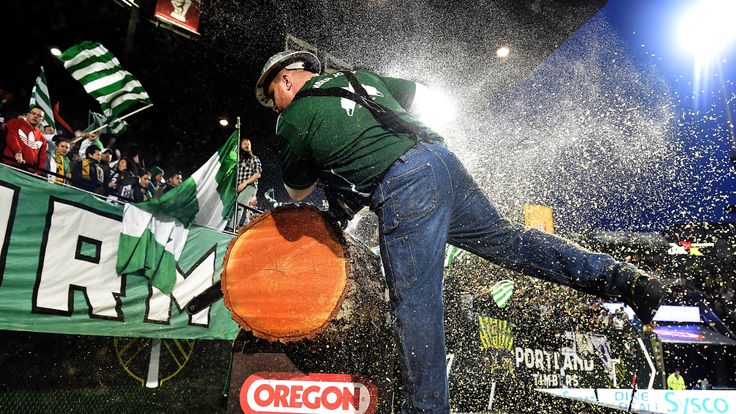 PORTLAND, OR - APRIL 04: Portland Timbers mascot 'Timber Joey' uses a chainsaw to cut a timber slab