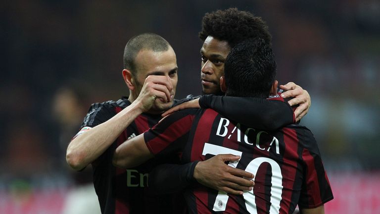 MILAN, ITALY - NOVEMBER 28:  Luiz Adriano (C) of AC Milan celebrates his goal with his team-mates Carlos Bacca (R) and Luca Antonelli (L) during the Serie 