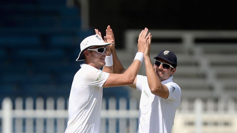 Stuart Broad and Alastair Cook celebrate the wicket of Mohammad Hafeez