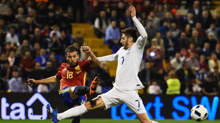 Jordi Alba beats Adam Lallana to the ball