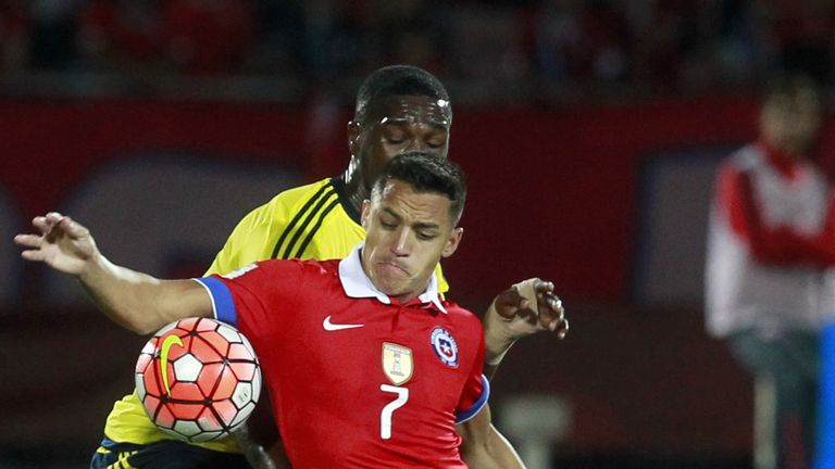 Chile's Alexis Sanchez (R) and Colombia's Cristian Zapata vie for the ball 