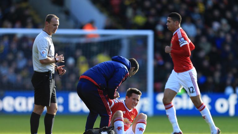 Ander Herrera receives treatment for a hamstring injury during Manchester United's game at Watford