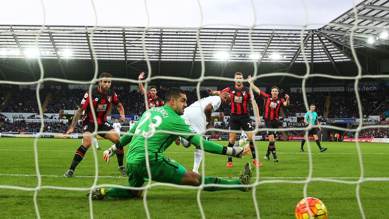 Andre Ayew of Swansea City scores his team's first goal past Adam Federici of Bournemouth