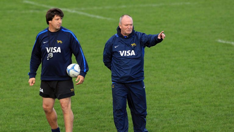 Graham Henry (R) offers advice  during an Argentina training session