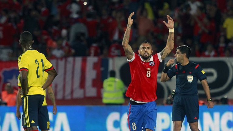 Chile's Arturo Vidal (R) celebrates next to Colombia's Jackson Martinez after scoring against Colombia 