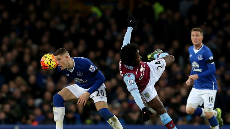 Ross Barkley of Everton and Carlos Sanchez of Aston Villa compete for the ball 
