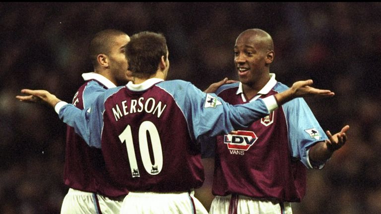 Dion Dublin of Aston Villa celebrates with team mates Paul Merson and Stan Collymore during the Premier League game against Liverpool in November 1998