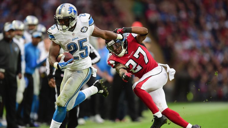 Theo Riddick #25 of the Detroit Lions evades a challenge from  Robert McClain #27 of the Atlanta Falcons during the NFL mat