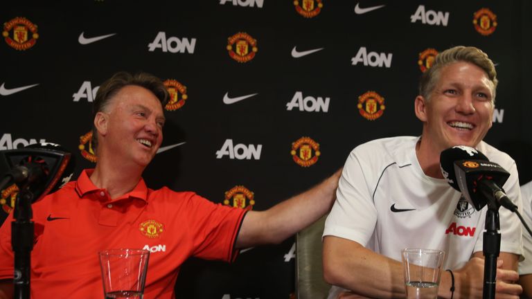 Bastian Schweinsteiger (r) with Manchester United manager Louis van Gaal shortly after signing for the club