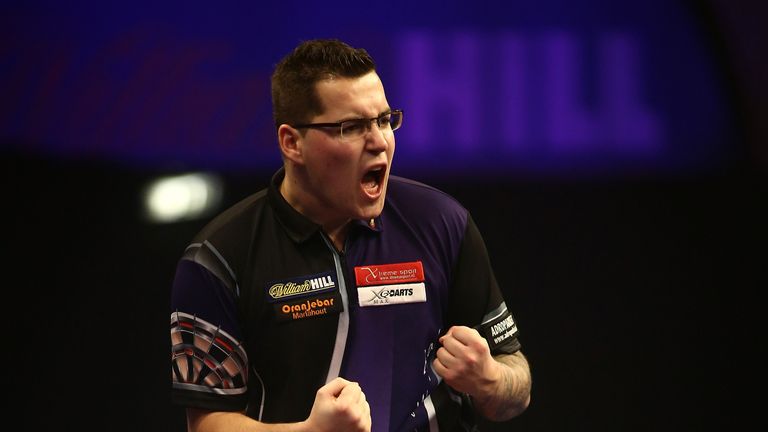 LONDON, ENGLAND - DECEMBER 27:  Benito van de Pas of Holland celebrates winning a leg during his second round match against Dave Chisnall of England on Day