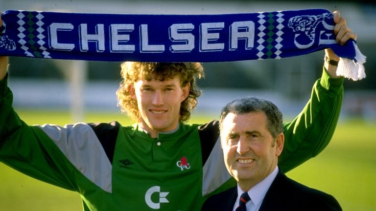 Chelsea Manager Bobby Campbell (right) stands alongside his new goalkeeper Dave Beasant who holds a scarf above his head at Stamford bridge in Londo