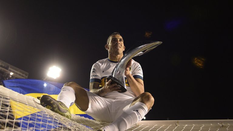 Boca Juniors' forward Carlos Tevez celebrates after winning Argentina's first division football championship.