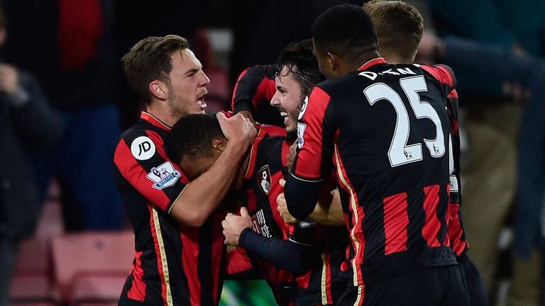 BOURNEMOUTH, ENGLAND - NOVEMBER 28:  Junior Stanislas (2nd L) of Bournemouth celebrates scoring his team's third goal during the Barclays Premier League ma