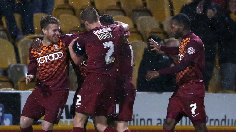 Greg Leigh is mobbed by team-mates after putting Bradford in front