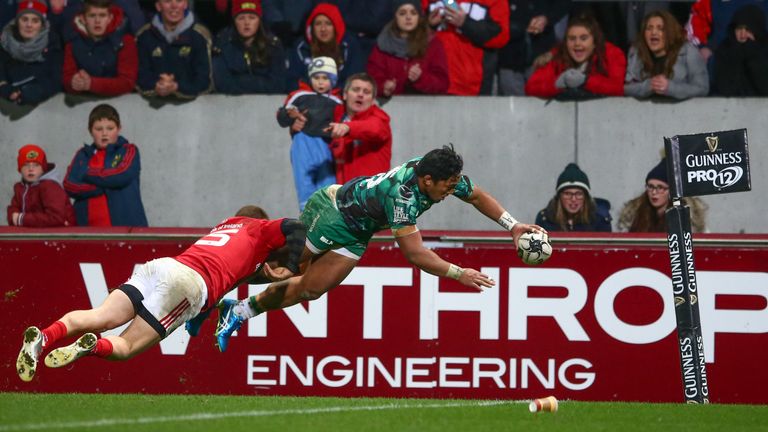 Connacht's Bundee Aki scores his side's second try despite attention from Andrew Conway of Munster