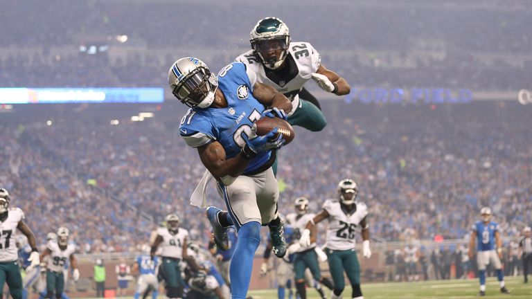 Calvin Johnson of the Detroit Lions and Eric Rowe of Philadelphia Eagles