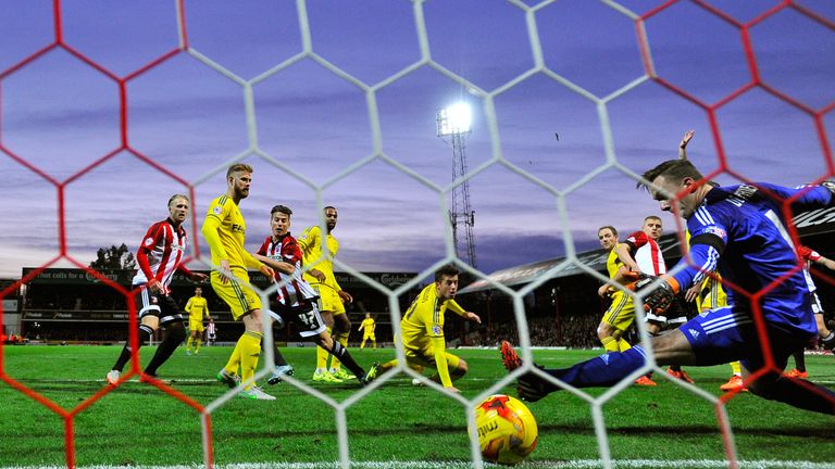 Canos (centre-left) scores his first Brentford goal against Nottingham Forest