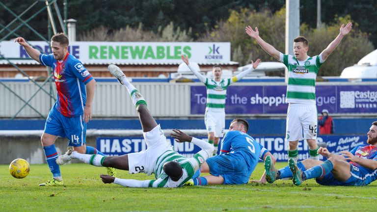 Celtic's Carlton Cole is caught up in a scramble in the box which leads to Inverness CT's Danny Devine deflecting the ball into the back of his own net 