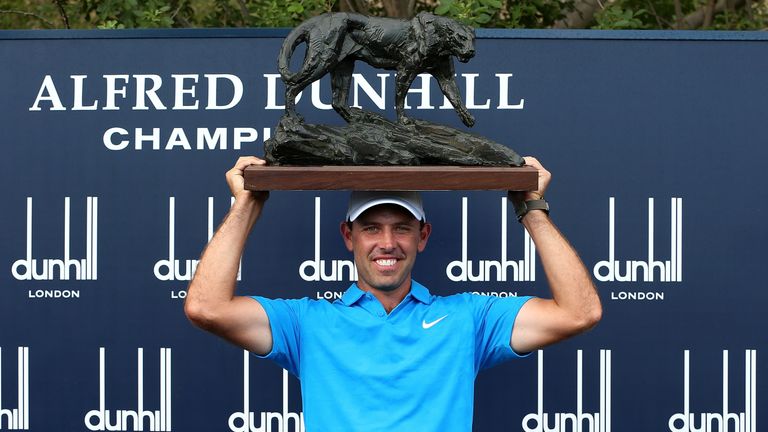Charl Schwartzel poses with the trophy after victory at the Alfred Dunhill Championship