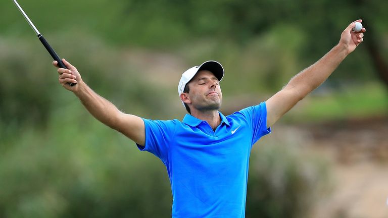 Charl Schwartzel celebrates after holing out on the final green