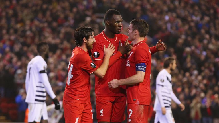 Christian Benteke of Liverpool (C) celebrates with Joe Allen (L) and James Milner (R) after scoring in the Europa League clash v Bordeaux