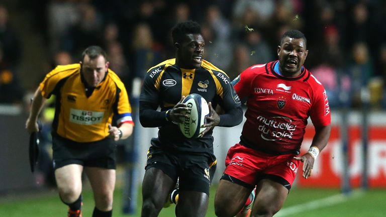 Christian Wade breaks clear of Steffon Armitage during the European Rugby Champions Cup match between Wasps and Toulon