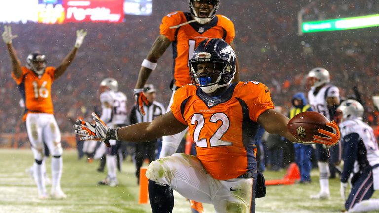 Running back C.J. Anderson #22 of the Denver Broncos celebrates after scoring a fourth quarter touchdown against the New England Patriots.