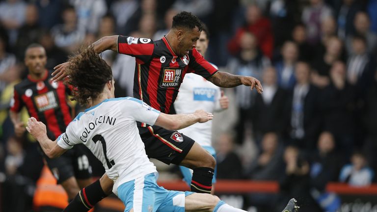 Newcastle United's defender Fabricio Coloccini (L) attempts to tackle Bournemouth's Joshua King.