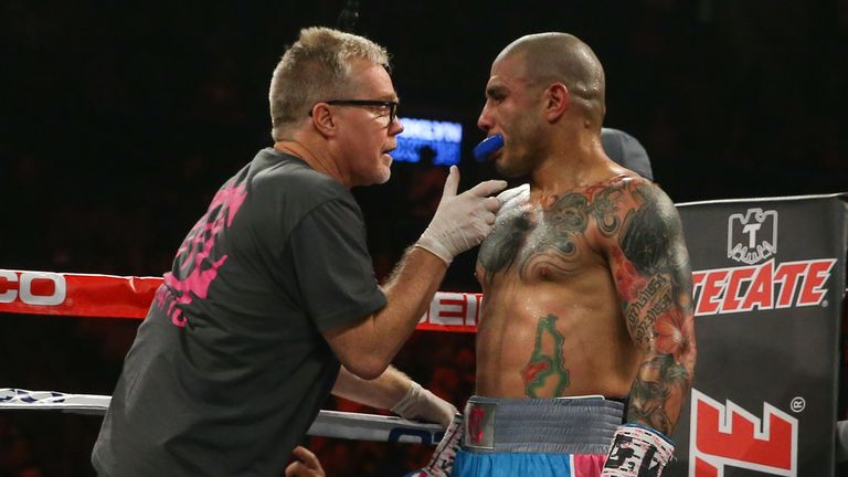 Miguel Cotto (R) and trainer Freddie Roach (L) during Cotto's WBC middleweight world championship fight against Daniel Geale