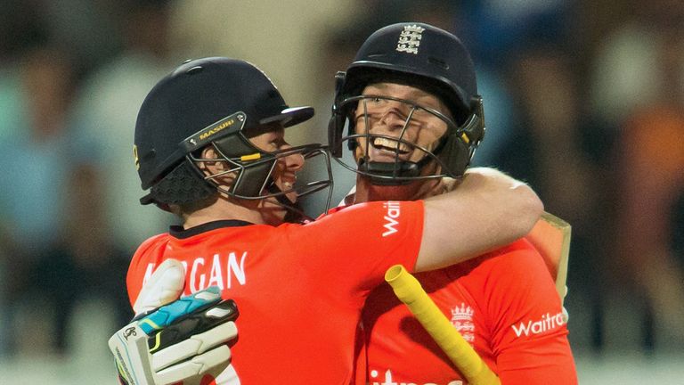 England's captain Eoin Morgan (L) and Jos Buttler celebrate their victory 