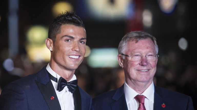 Real Madrid forward Cristiano Ronaldo (L) poses with former Manchester United manager Sir Alex Ferguson at the world premiere of the film Ronaldo