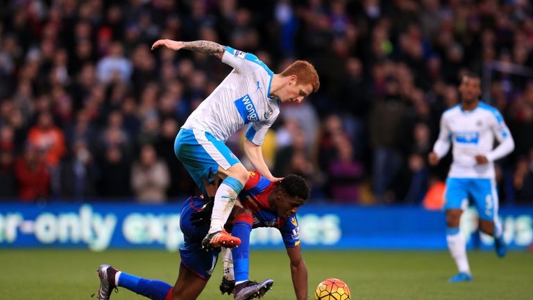 Crystal Palace's Wilfried Zaha, (right) battles for possession of the ball with Newcastle United's Jack Colback 