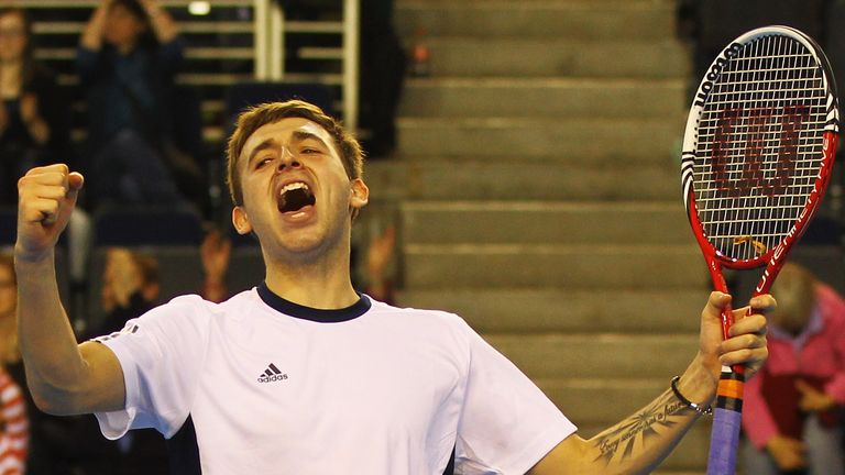 Dan Evans of Great Britain celebrates his win against Martin Klizan of the Slovak Republic during the final day of the 2012 Davis Cup tie