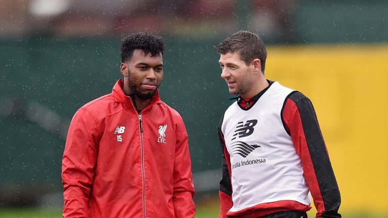 Steven Gerrard and Liverpool striker Daniel Sturridge suffer the rain in training at Melwood