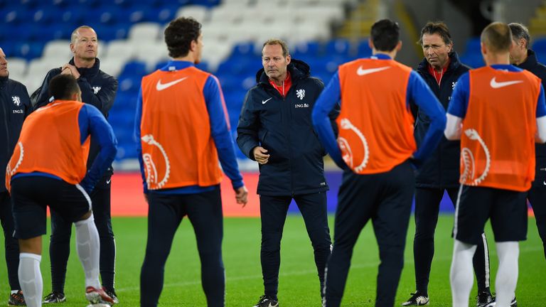 Netherlands head coach Danny Blind speaks to his players during an open training session ahead of their friendly v Wales in Cardiff