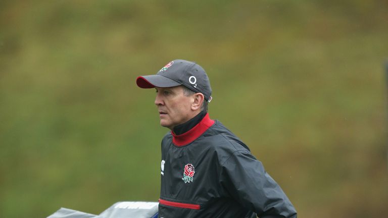 BAGSHOT, ENGLAND - MARCH 16:  Dave Tennison, the England kit technician carries the tackle bags during the England training session held at Pennyhill Park 