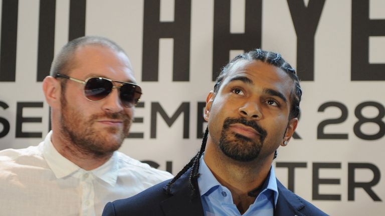 British heavyweight boxers David Haye (R) and Tyson Fury attend a press conference to announce their upcoming title fight on Ju