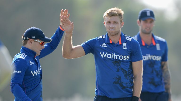 ABU DHABI, UNITED ARAB EMIRATES - NOVEMBER 08:  David Willey of England celebrates with captain Eoin Morgan after dismissing Anshuman Rath of Hong Kong dur