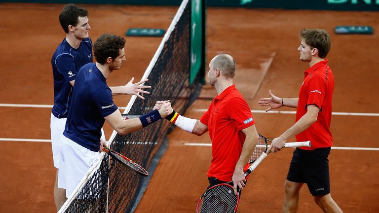 Jamie Murray and Andy Murray of Great Britain shake hands with Steve Darcis and David Goffin of Belgium