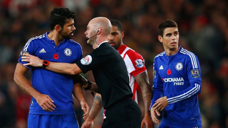 Diego Costa of Chelsea is blocked by referee Anthony Taylor after the Barclays Premier League match between Stoke City and Chelsea 