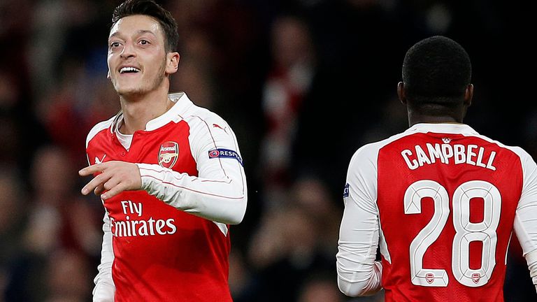 Arsenal's German midfielder Mesut Ozil celebrates after scoring against Dinamo Zagreb