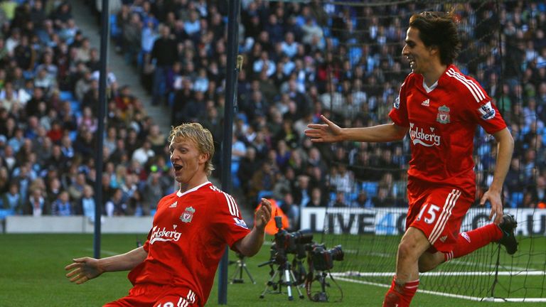 MANCHESTER, UNITED KINGDOM - OCTOBER 05:  Dirk Kuyt of Liverpool celebrates scoring the winning goal with team mate Yossi Benayoun (R) during the Barclays 