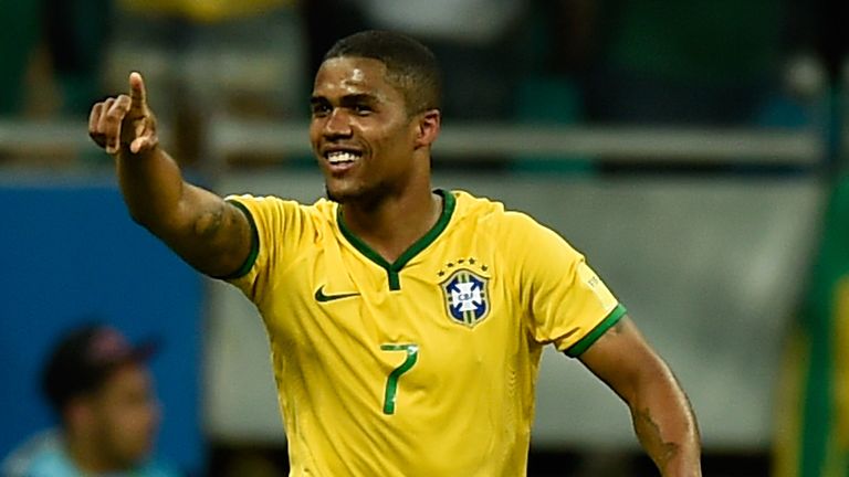 Douglas Costa of Brazil celebrates after scoring against Peru