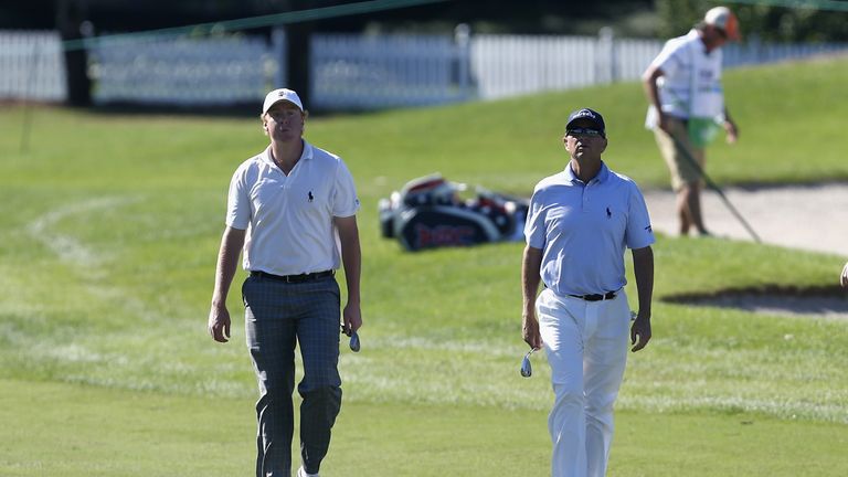 ST SIMONS ISLAND, GA - NOVEMBER 20:  (L-R) Davis (Dru) Love IV and Davis Love III walk down the 1st fairway on the Plantation Course