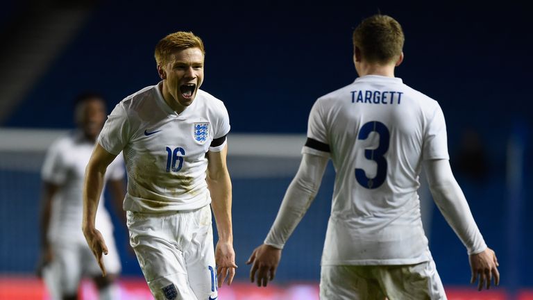 Duncan Whatmore of England celebrates with team mate Matt Targett after scoring during a European Under 21 Qualifier