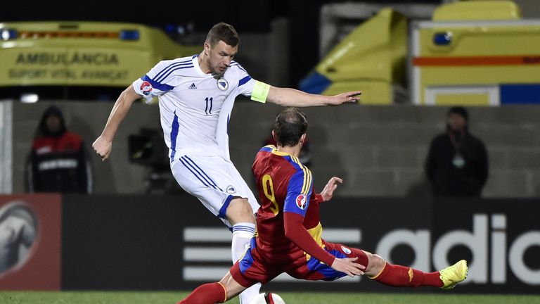 Bosnia and Herzegovina's forward Edin Dzeko (L) vies with Andorra's forward Gabriel Riera