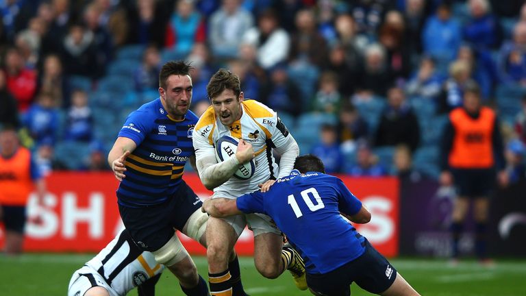 Elliot Daly of Wasps is tackled by Johnny Sexton of Leinster