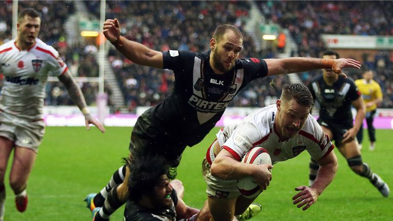 Elliott Whitehead of England goes over for a try against New Zealand at the DW Stadium.